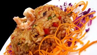 closeup photo of colorful risotto with vegetables and shrimps