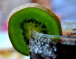 a piece of kiwi on the glass