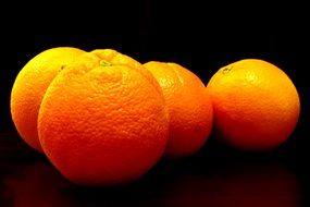 oranges on a black background