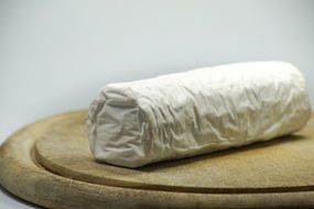 white cheese on wooden board