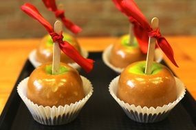 caramel apple snack on black dish