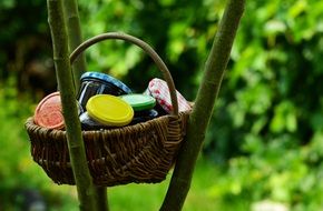 jam jars in the basket on a bamboo