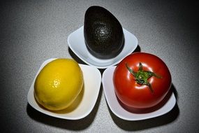 Different vegetables on the white plates