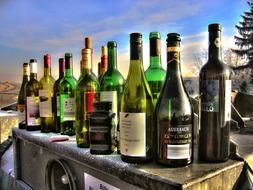 empty alcohol bottles outdoor, alcohol abuse concept