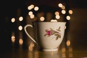 cup with a drink on the background of lights