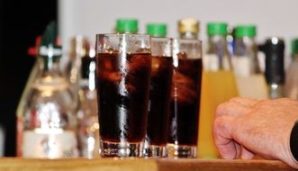 two glasses of cold alcoholic drink with ice