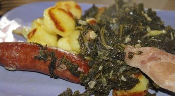 kale with smoked pork chops close up