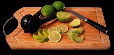 Limes on the cutting board and knife