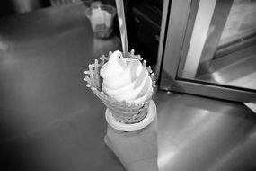 cone with ice cream in hand, black and white