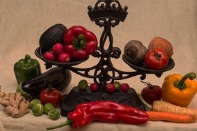 still life in the form of old scales with vegetables