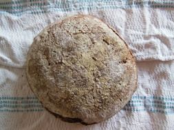 top view of homemade fresh bread on a white towel