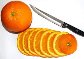 sliced orange and kitchen knife