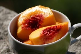 Orange peaches in a bowl