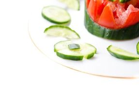 Vegetable salad with cucumbers and tomatoes on the plate