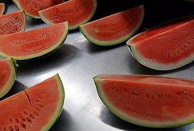 watermelon slices on grey table