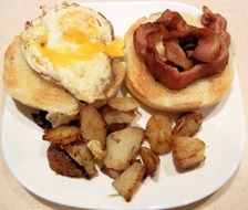 nutritious breakfast with bacon, egg ,potatoes and toast