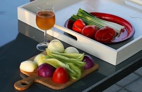 vegetables on the background of a glass with wine