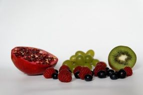 Blueberries and raspberries on a background of other fruits