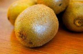 Kiwis on the wooden table