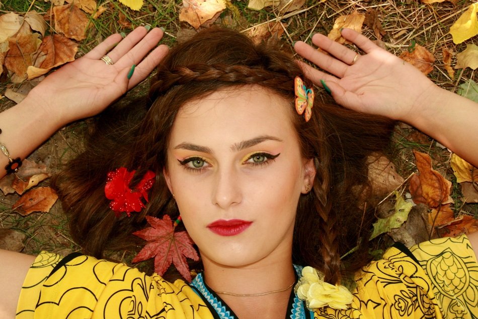 the autumn image of girl with opened eyes