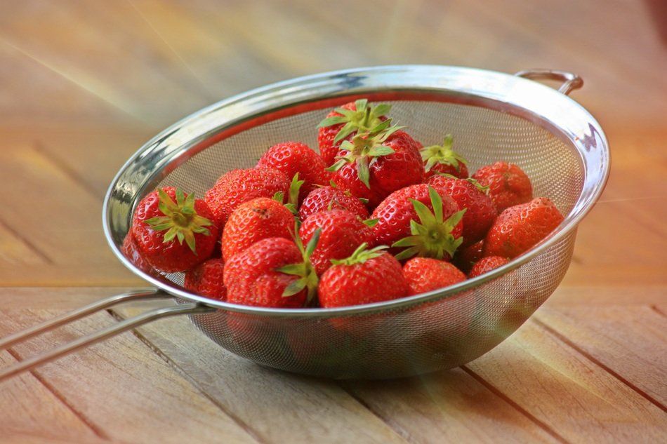 bright fresh strawberries in a sieve