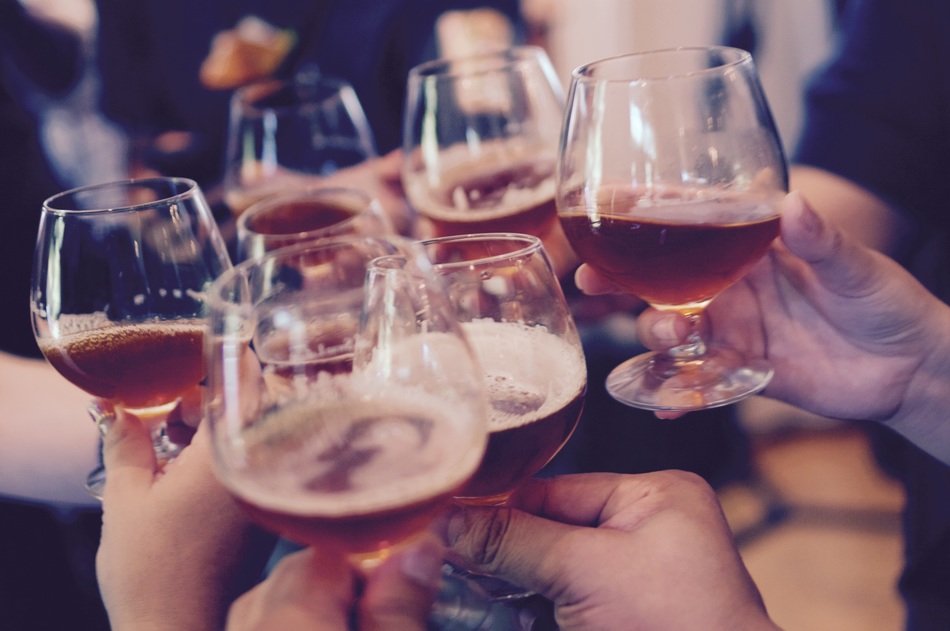 people cheers with glasses of brandy to celebrate