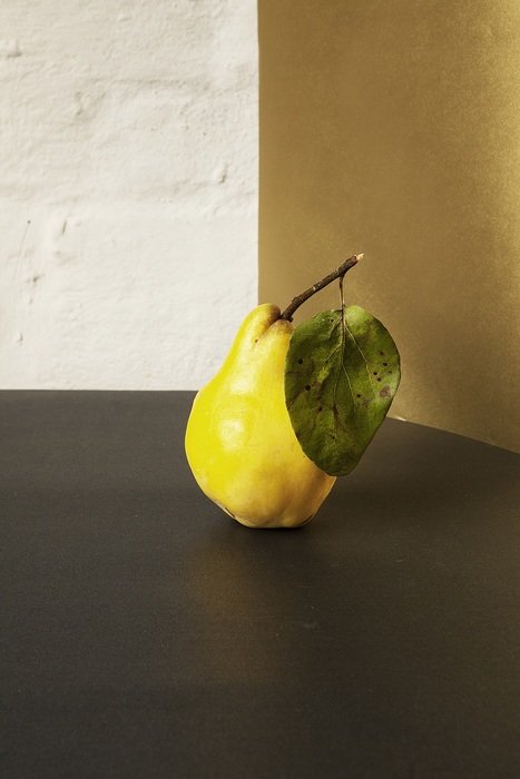 fresh yellow pear on the dark surface