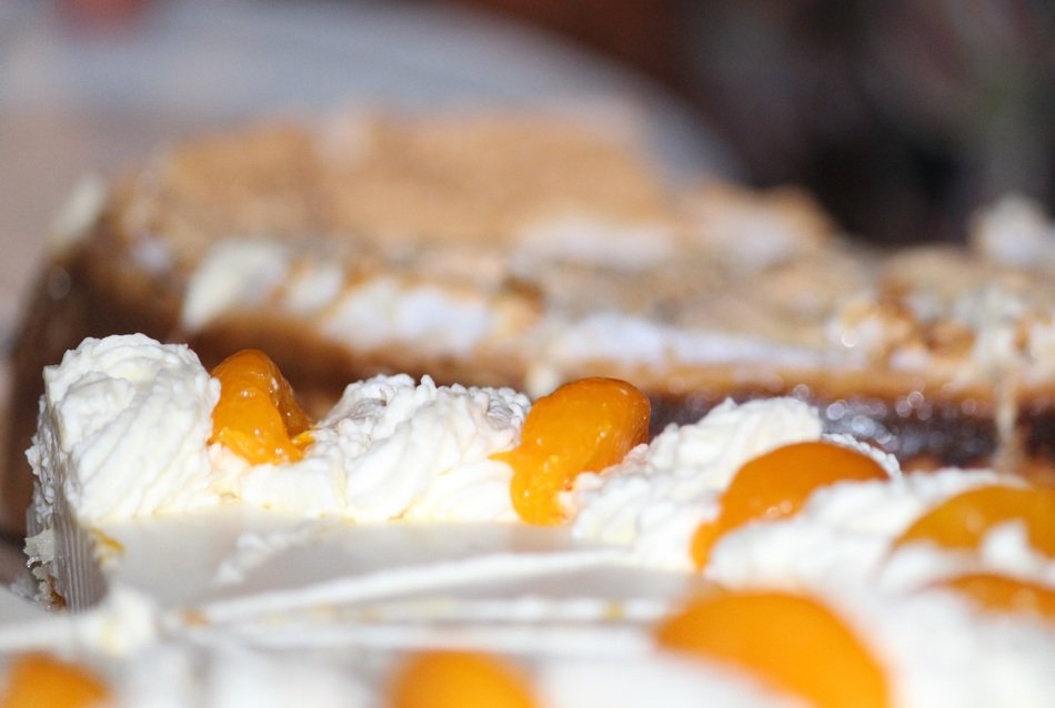 cream cake with peaches close-up