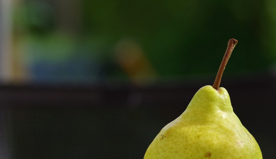 top of pear fruit at blurred background
