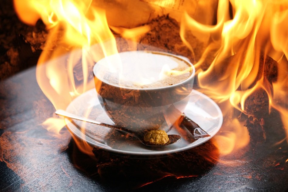 cup of coffee on fire background