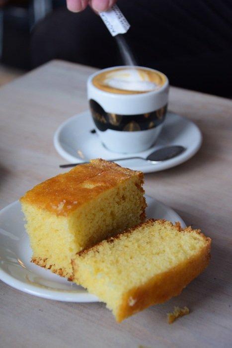 coffee cup with sugar and piece of pie