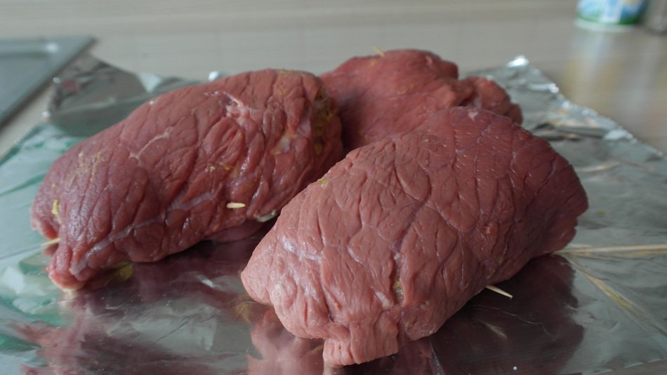 beef rolls on foil