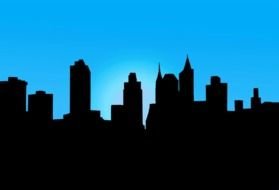 black silhouette of a megalopolis on a background of blue sky