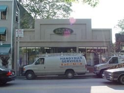 handyman van is parked on the street