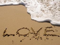 Love Sand text drawing