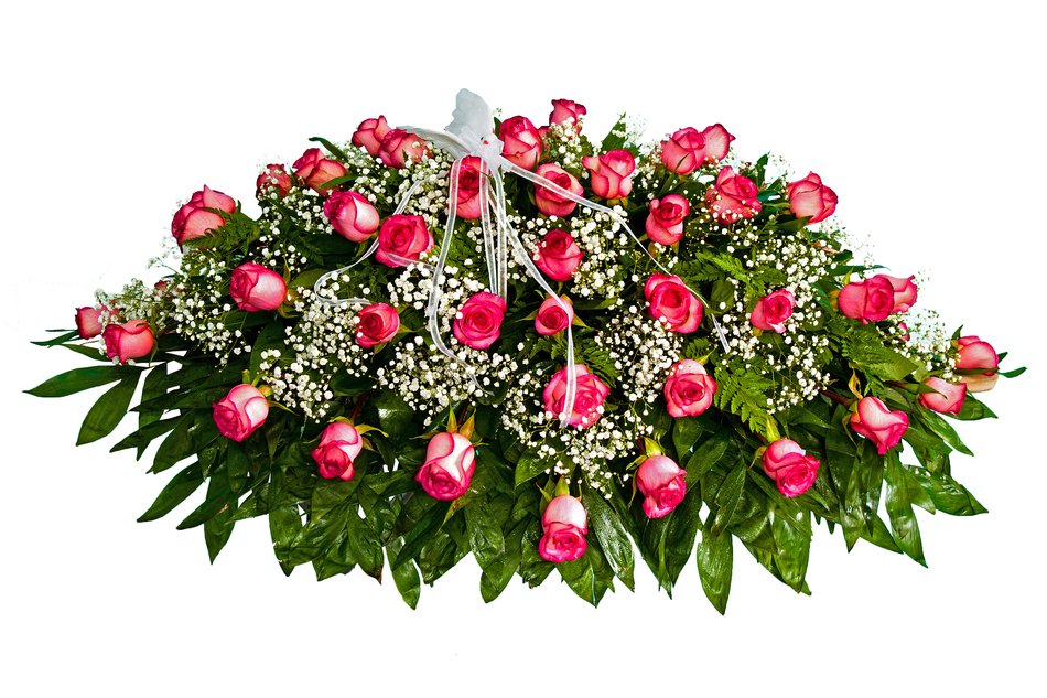 bouquet of pink roses with green leaves and tiny white flowers