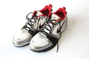 photo of three-color nike sneakers on a white background