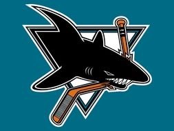 logo with a shark on a blue background