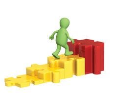 green figure on colorful puzzles as a way to the goal