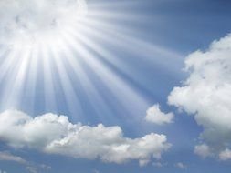 sun beams bursting through white cloud
