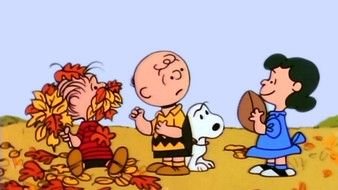 Charlie Brown walks outside in the fall