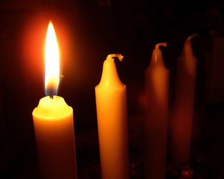 candles with flame in the dark