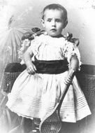 old photo of a little girl in a white dress