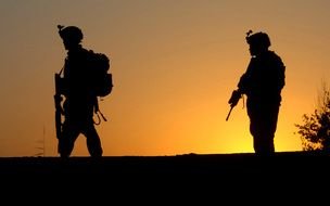 two american military against yellow evening sky