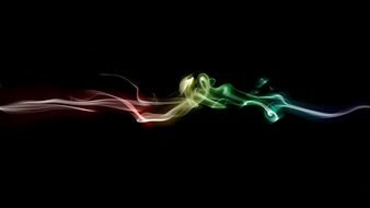 line of colorful smoke on a black background