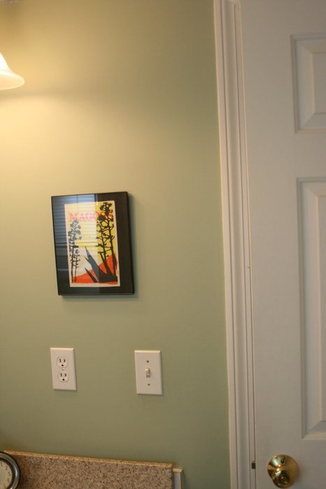 photo framed hanging on the wall in the house