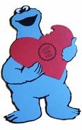 paper blue monster with a heart in hands
