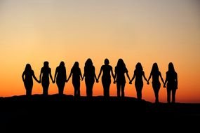 Women Holding Hands Silhouette sunset
