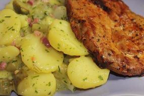 potatoes with meat on a plate