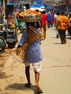 man carries food in india